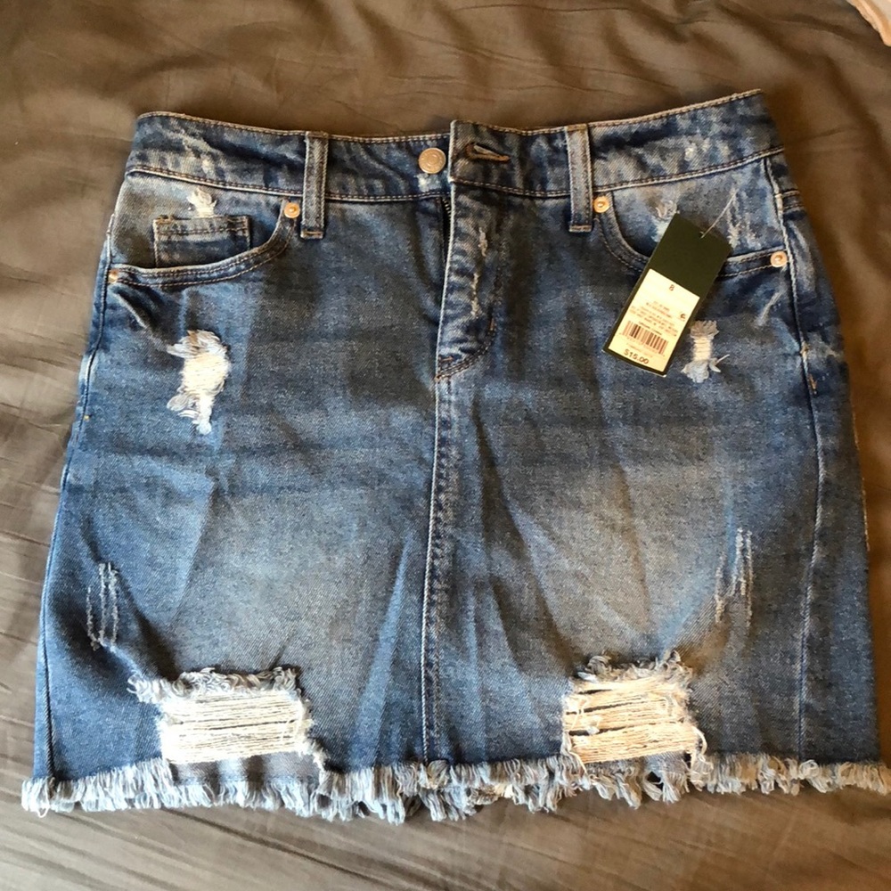 NWT partially distressed jean skirt
